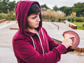 young man show a trick with cards