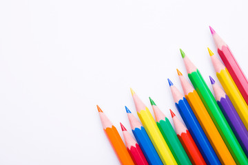Different color pencils on white background. Composition with colored pencils, closeup view, space for text