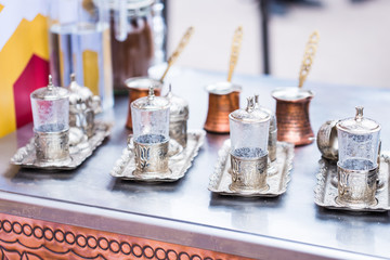 Oriental tableware concept - Moroccan tea glasses on the table