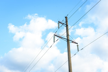Electric pole on blue sky background.