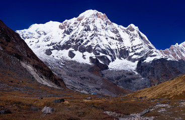 Obraz premium Mount Gangapurna one of the prominent mountain seen from Annapurna Base Camp with the trekking path in the foreground