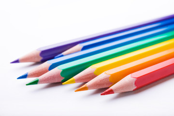 Different color pencils on white background. Composition with colored pencils, closeup view