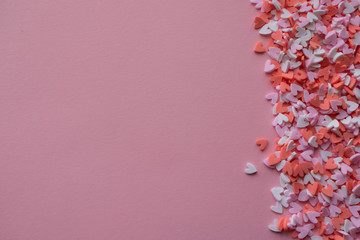 mini hearts on pink background