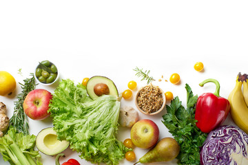 Various healthy raw organic vegetables, herbs, sprouts and fruits isolated on white background. Top view vegetarian food with copy space