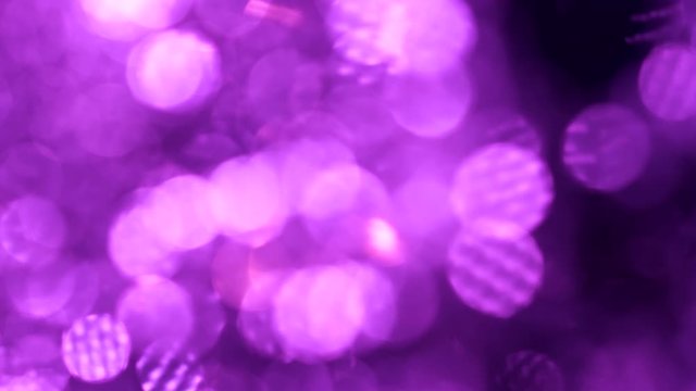 Big bokeh background. Purple or violet defocused circular facula. Natural Floating Organic Abstract Particles. Glittering Particles With Bokeh