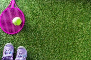 Summer office, work on vacation, freelance concept. Keyboard, notepad, earphones, office supplies, water and coffee on a green summer grass background. Flatlay top view copy space for your text
