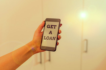 Writing note showing Get A Loan. Business concept for mount of money that is borrowed often from...