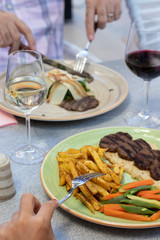 Grilled minced meat stakes served with french-fries and sauce