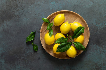 Fresh lemons with leaves, summer citrus lemonade ingredient