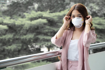 Asian woman wearing a protective face mask for plague coronavirus. Facial hygienic mask for safety...