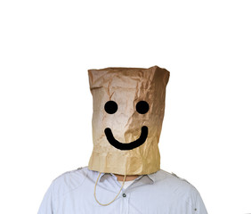 Kraft paper bag is on the man's head. Happy face smile sign. Isolated on white background.