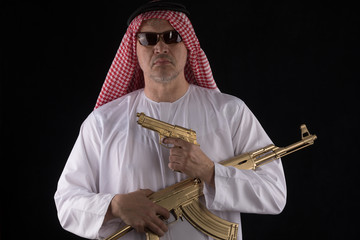 man with a golden assault rifle AK-47