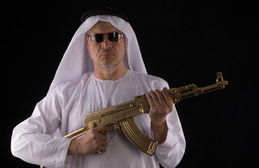 man with a golden assault rifle AK-47