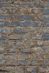 Old vintage shabby brick wall with peeling plaster. Grungy loft texture, background.