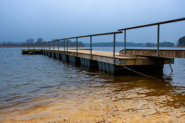 Fototapeta premium Floating wooden pier on the lake