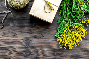 concept International Women Day with flowers wooden background top view