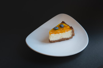 top view on piece of homemade cake with berry decorate on top