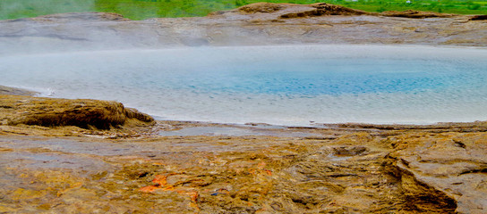 Hot volcanic springs Blesi around famous Strokkur geysir in National Park on Iceland with beautiful scenery and nature landscape © Tamme Wichmann