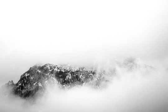 Black and white mountains under the snow clouds in Romania