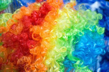 Closeup shot of a rainbow-colored wig for clowns