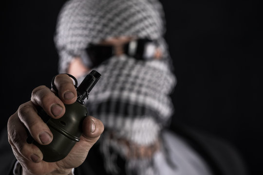 terrorist with a grenade in his hand