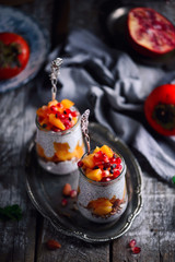 chia pudding with persimmon and pomegranate.