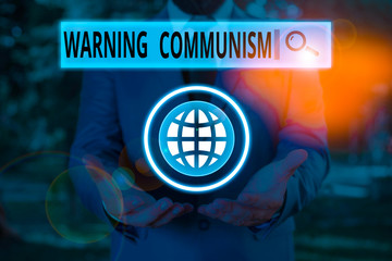Word writing text Warning Communism. Business photo showcasing economic system where the group owns...
