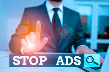 Conceptual hand writing showing Stop Ads. Concept meaning program that will remove different kinds...