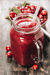 Pure fresh Cranberry smoothie on rustic wooden background