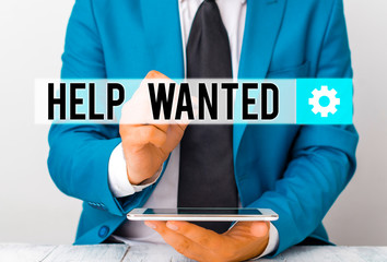 Writing note showing Help Wanted. Business concept for An ad in the paper an employer places to...