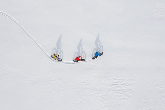 Aerial Drone Photo Of A Group Of Friends Riding Their Fat Bike In The Snow In Ontario, Canada