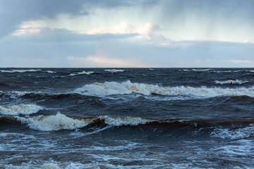 Moody sea view on a windy and cloudy day with waves at the Baltic sea n Latvia
