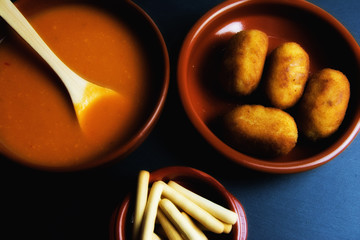 Cold tomato soup, fresh homemade croquettes and breadsticks. Spanish gastronomy