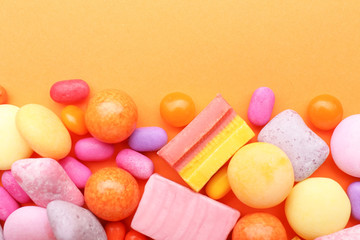 Different chewing gums on color background
