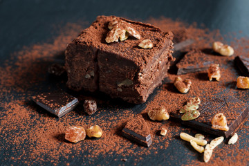 chocolate brownie, nuts chocolate pieces viewed from above