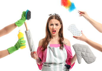 Funny housewife and hands with different items on white background