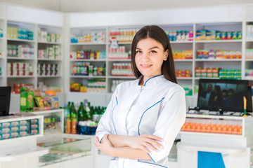 smart and confident woman pharmacist holding her arms crossed and smiling