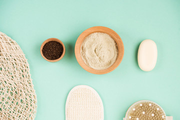 Cosmetic bath salt, grape gomaj for the face, coffee scrub for the body on a mint background. Spa cosmetic, zero waste.