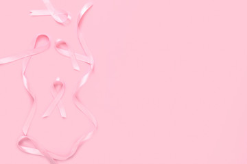Pink ribbons on color background. Breast cancer awareness concept