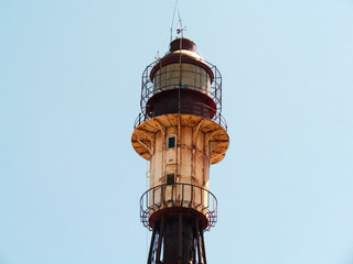 Fototapeta na wymiar Lighthouse by the beach