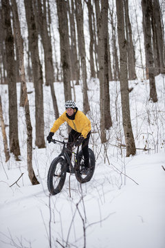 Man riding his fat bike in the snow in Ontario, Canada