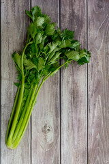 fresh celery on old wooden background