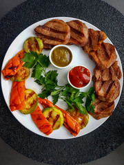 Grilled beef tongue with zucchini and pepper.
