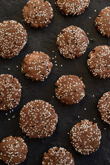 Healthy vegan cookies. Gluten free chocolate sesam seed bites on black background