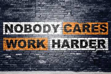 Nobody cares work harder saying lettering Graffiti on Brick Wall