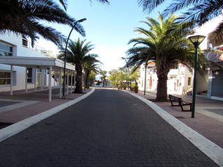 Tree-lined streets and buildings in the center of Monte Hermoso