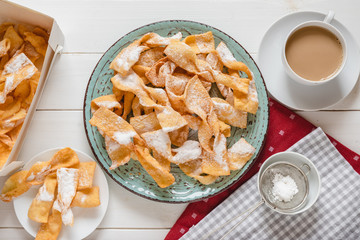Faworki, Chrusty, Angel Wings - traditional Polish pastries served during Carnival Fat Thursday, just befor Lent. - obrazy, fototapety, plakaty