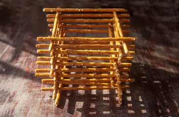 geometric still life of salty cookies straws