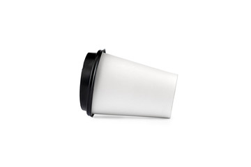 White disposable paper coffee cup with a black plastic lid isolated on white background