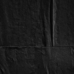 Dark black grey paper background creased crumpled surface / Old torn ripped posters scary grunge...